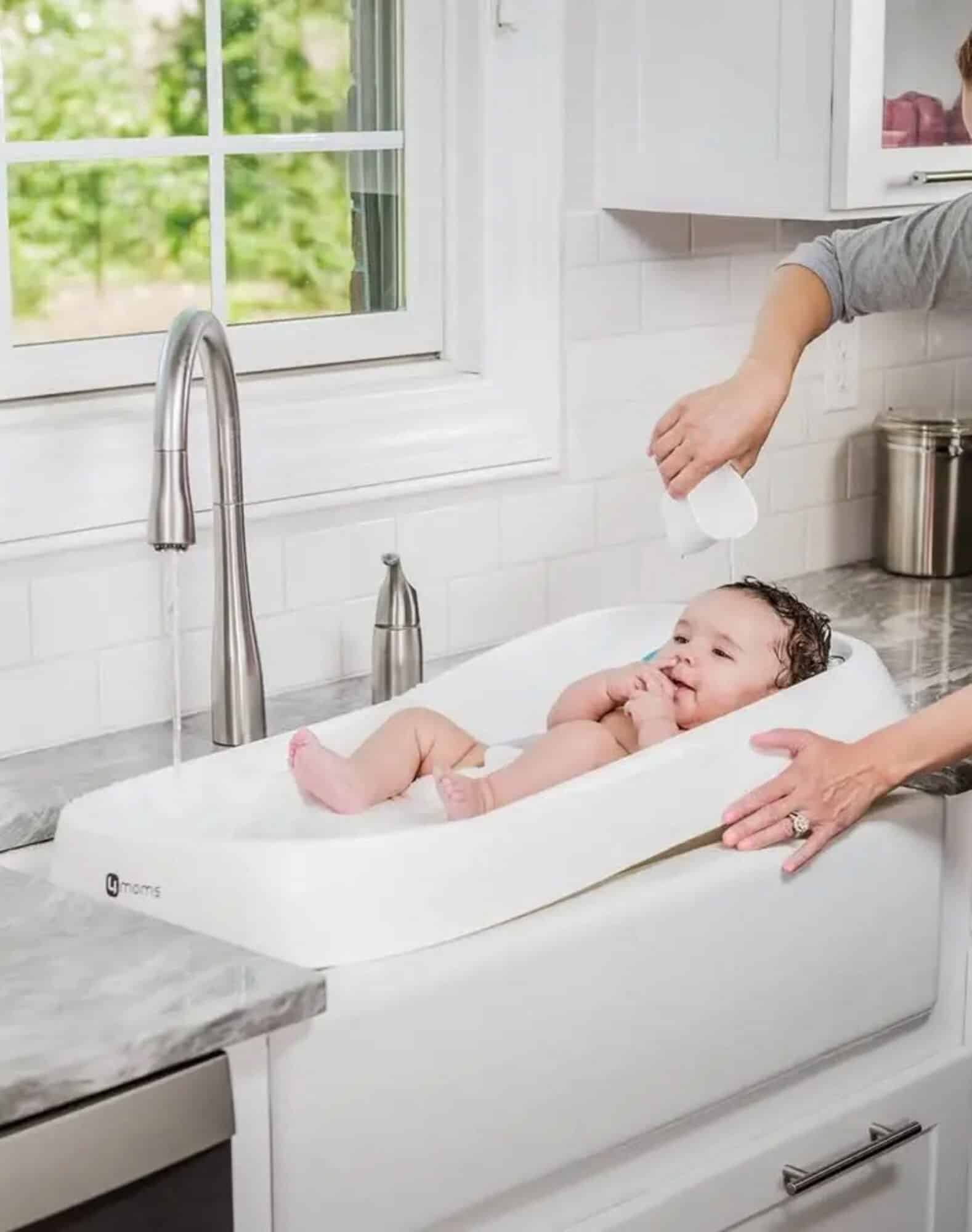 4moms Cleanwater infant tub showing the fresh-water reservoir and side drain, for rent near Siesta Key